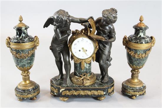 An early 20th century French bronzed spelter, ormolu and green marble clock garniture, 21in.